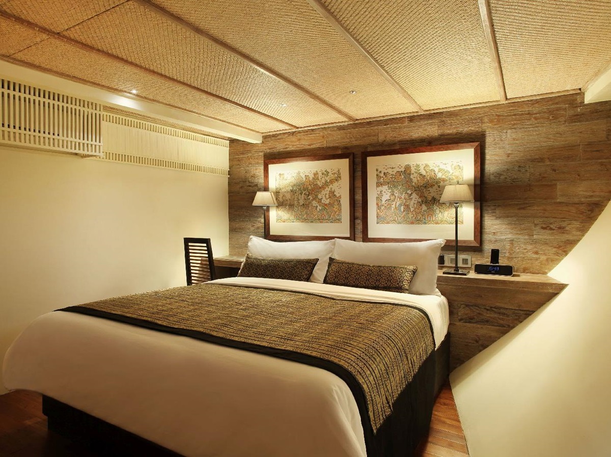 A luxurious guest suite on board the Alila Purnama phinisi yacht in Indonesia