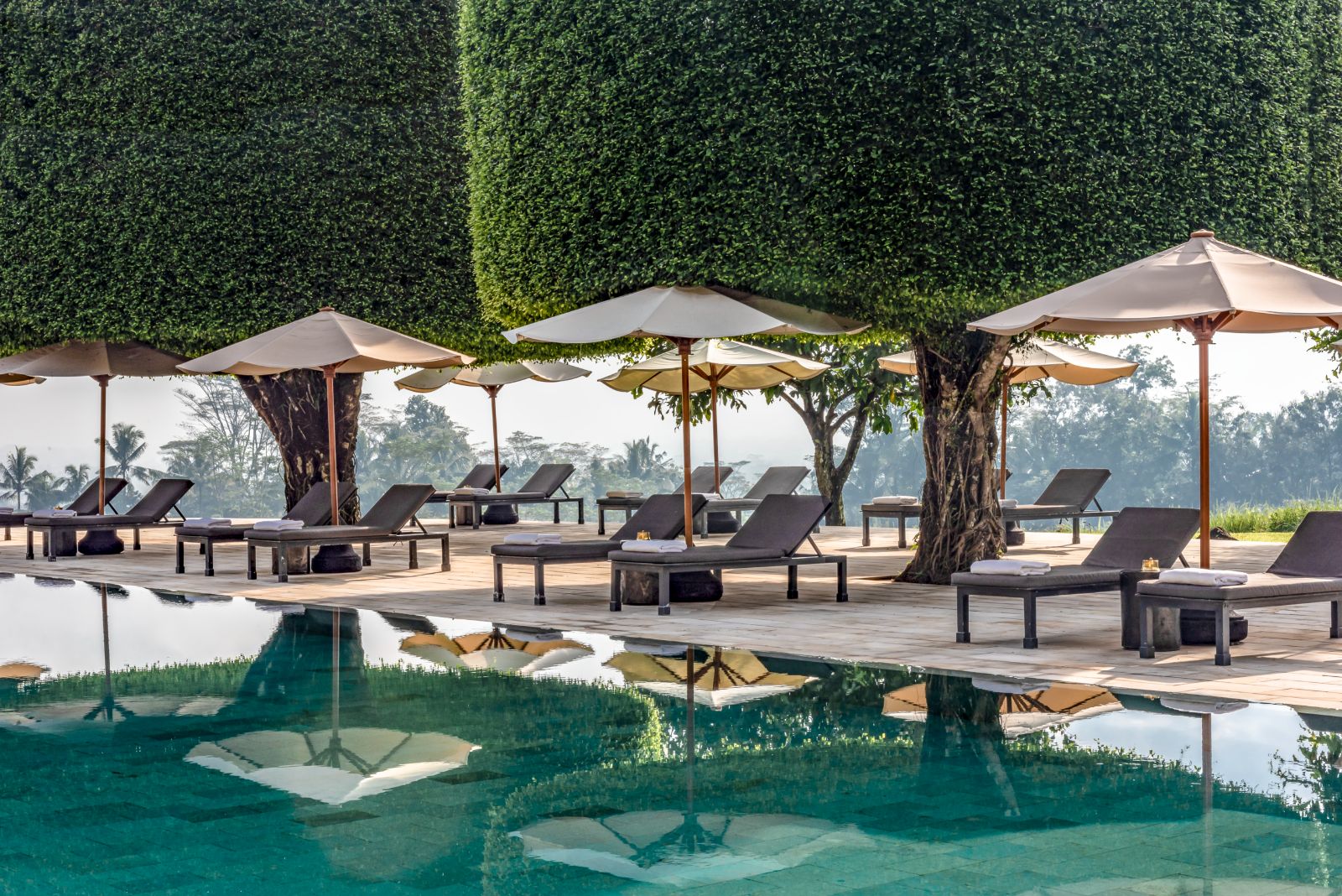 Sunbeds by the pool at Amanjiwo in the Java region of Indonesia