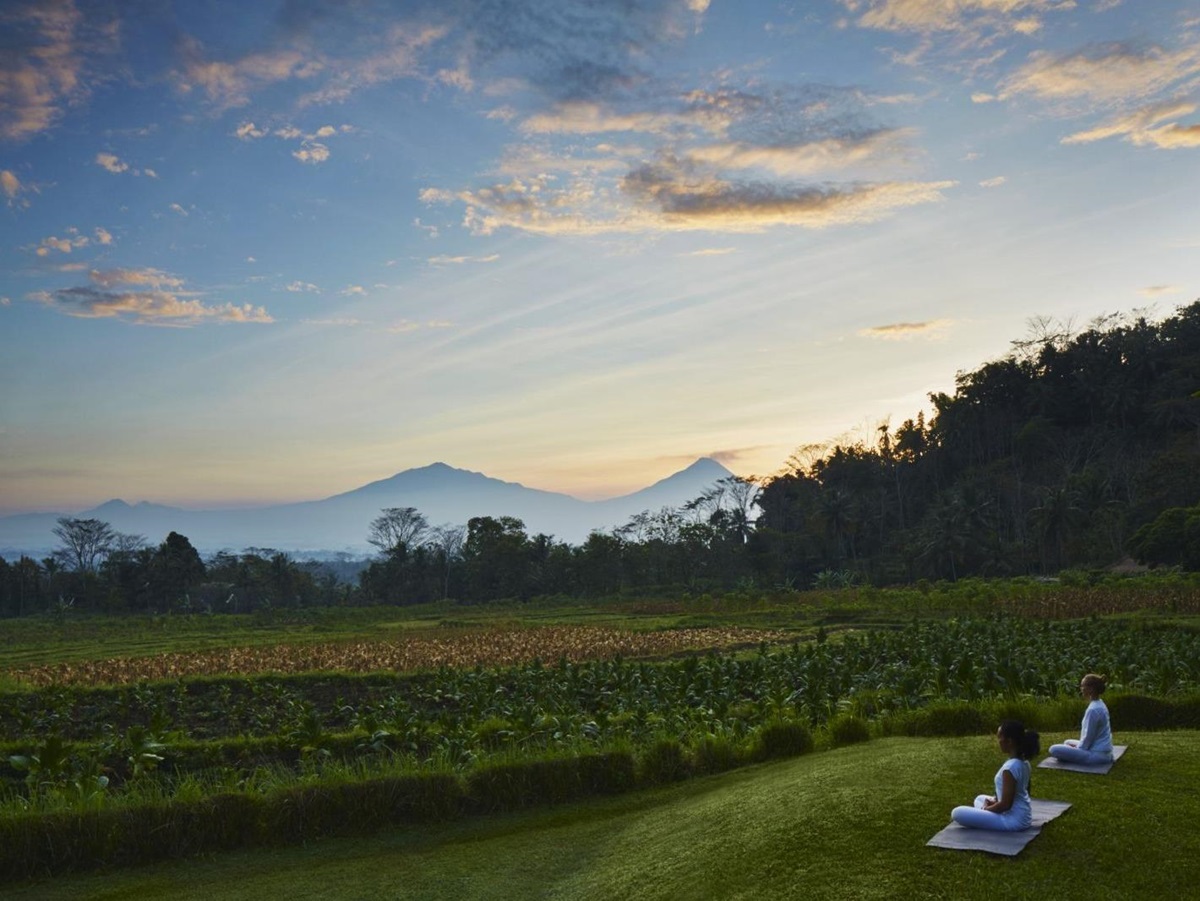 Yoga overlooking the rice paddies at Amanjiwo in the Java region of Indonesia