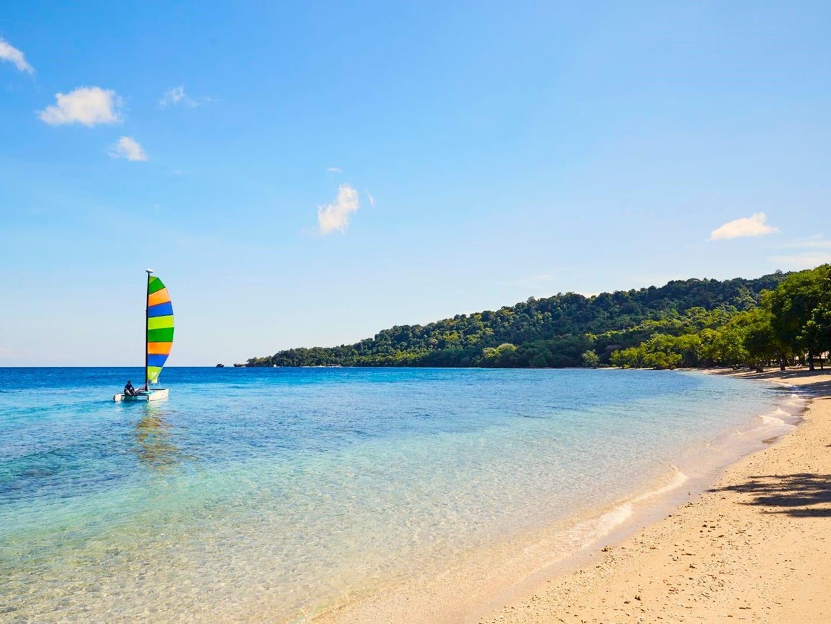 Sailing on the beach at Amanwana on Moyo Island