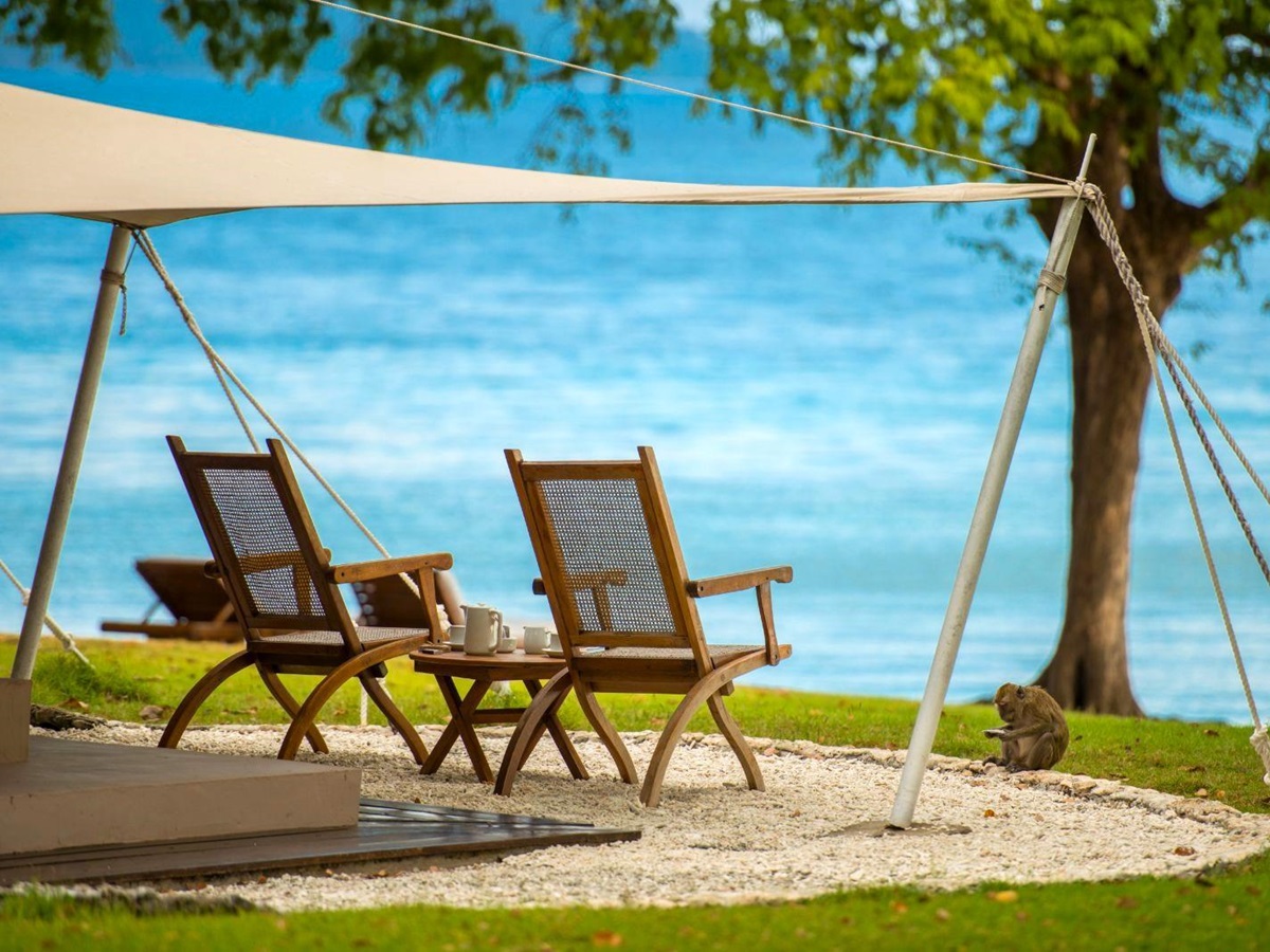 Chairs outside an Ocean Tent overlooking the sea on Moyo Island