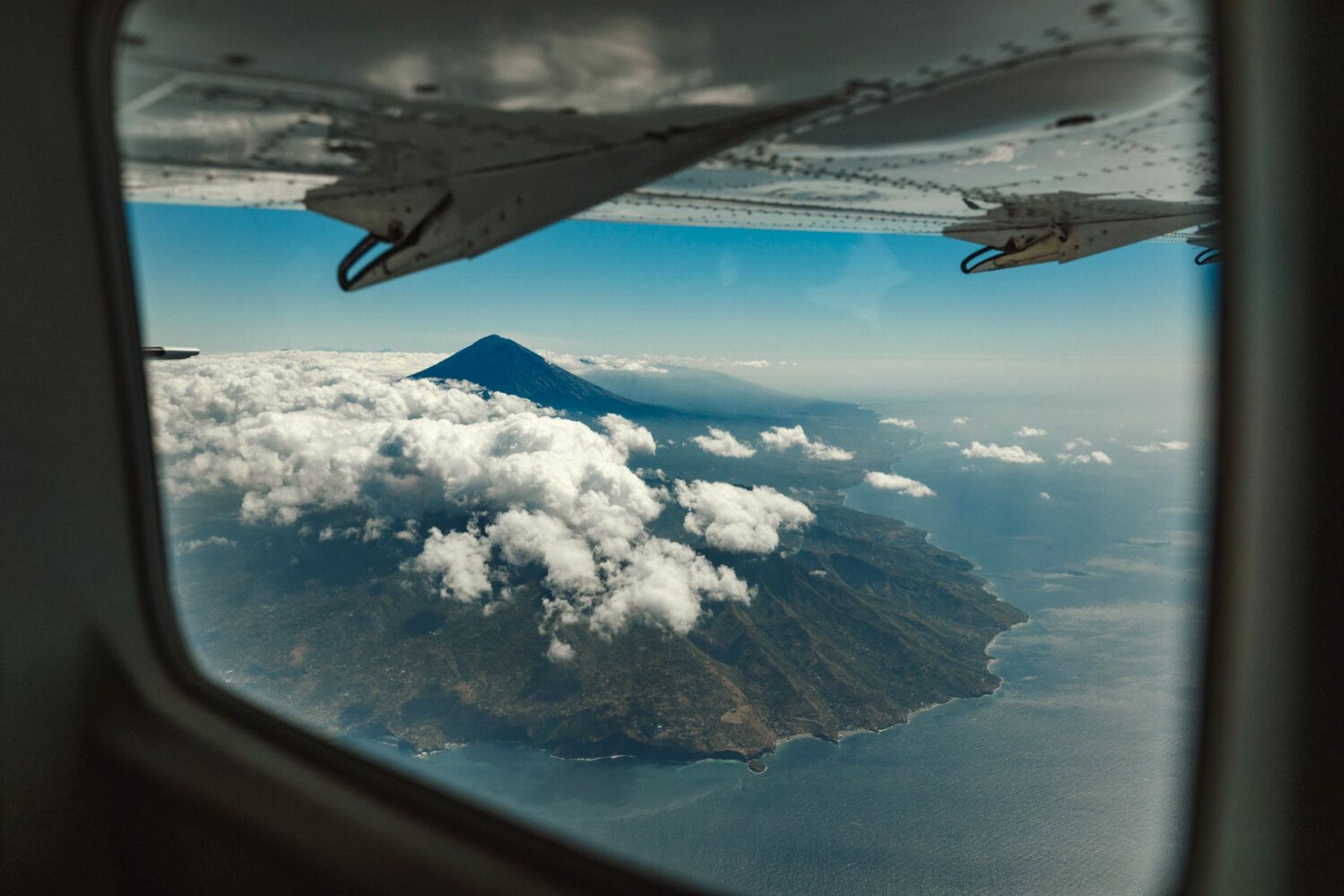 View of volcanic peak on a flight arriving in Amanwana Indonesia