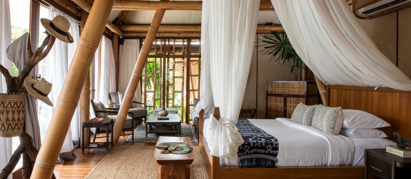 Bedroom in a deluxe pool villa at luxury resort Bawah  