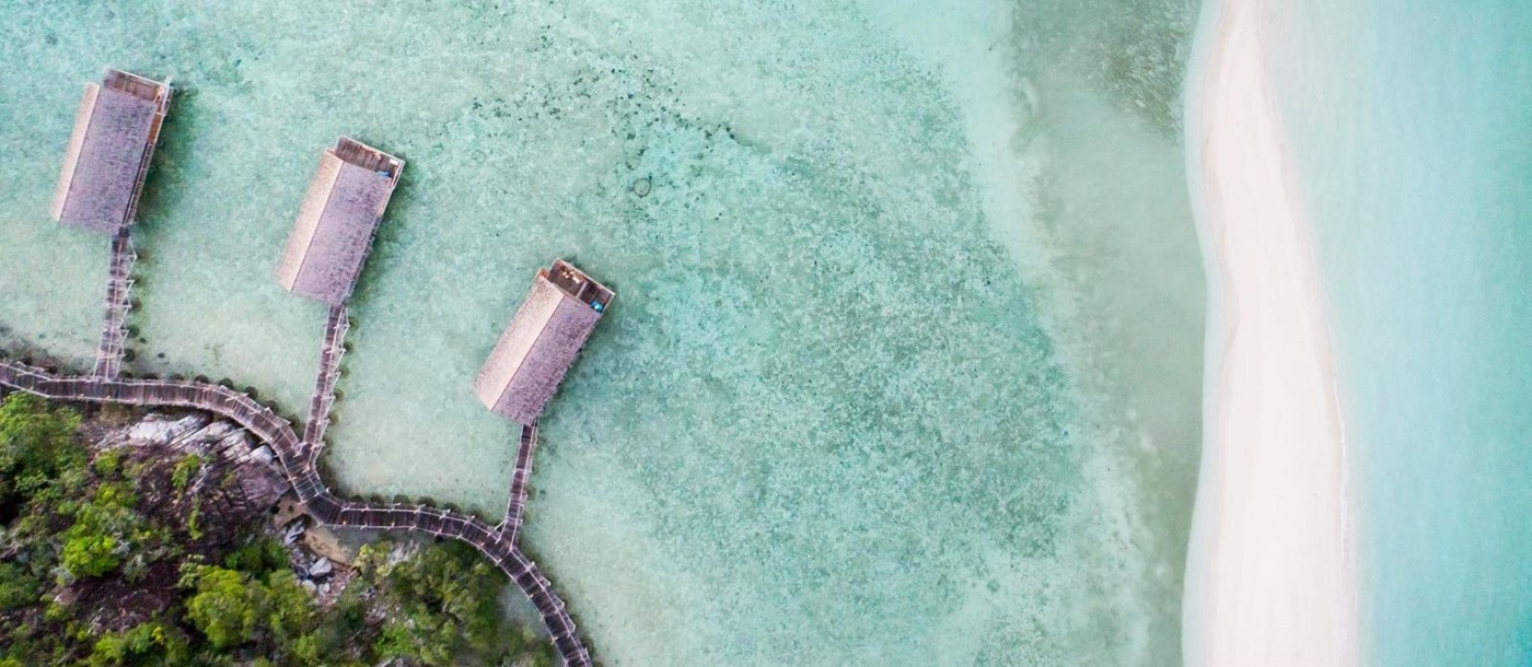 Aerial view of the overwater bungalows at Bawah Private Reserve Indonesia