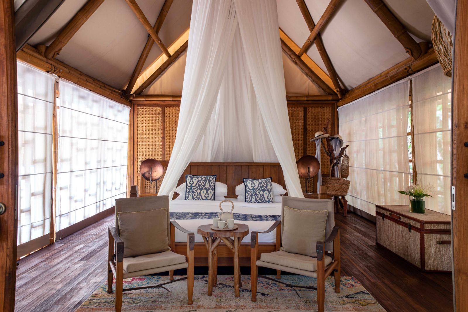 Bedroom in a garden pool villa at Bawah Reserve in Indonesia