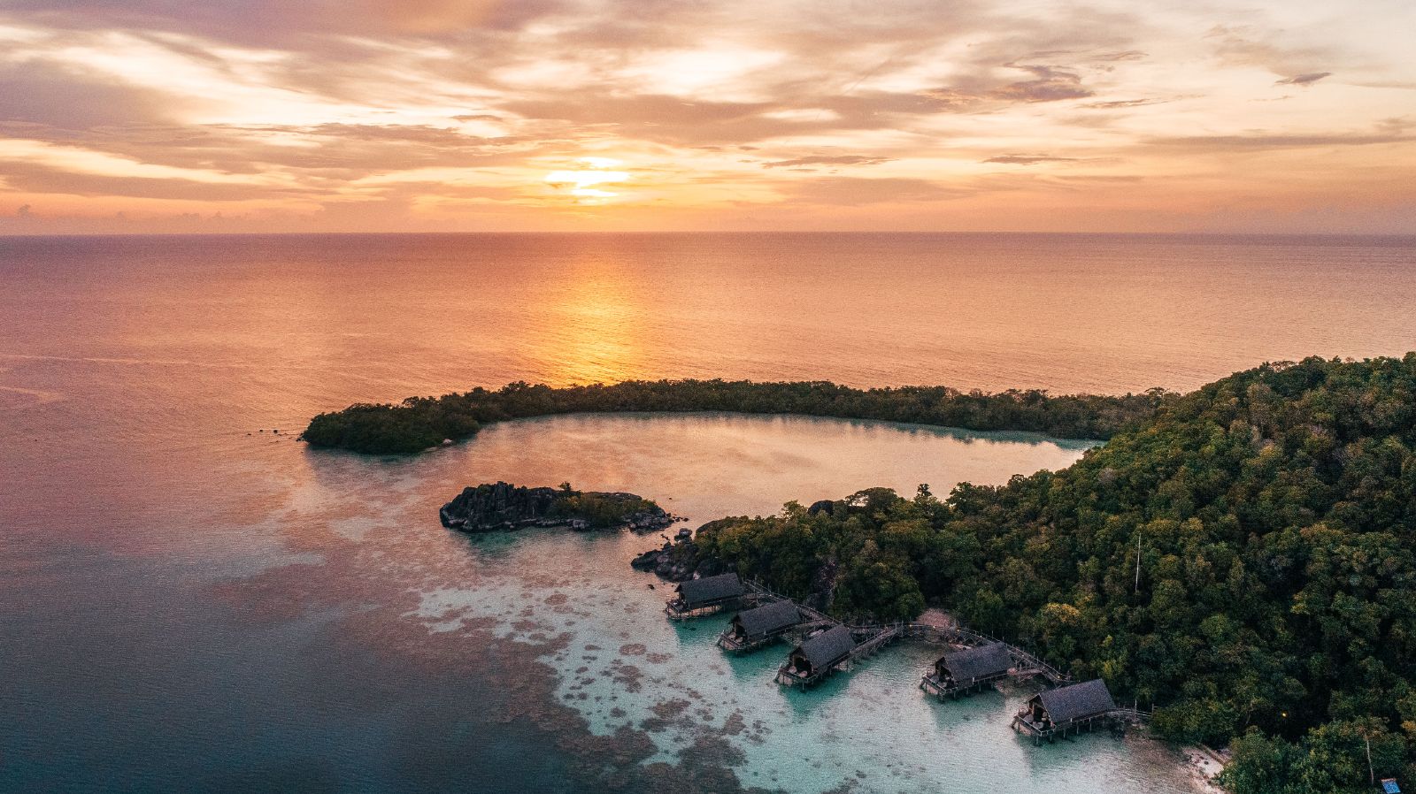 Sunset overlooking the reserve at luxury resort Bawah in Indonesia