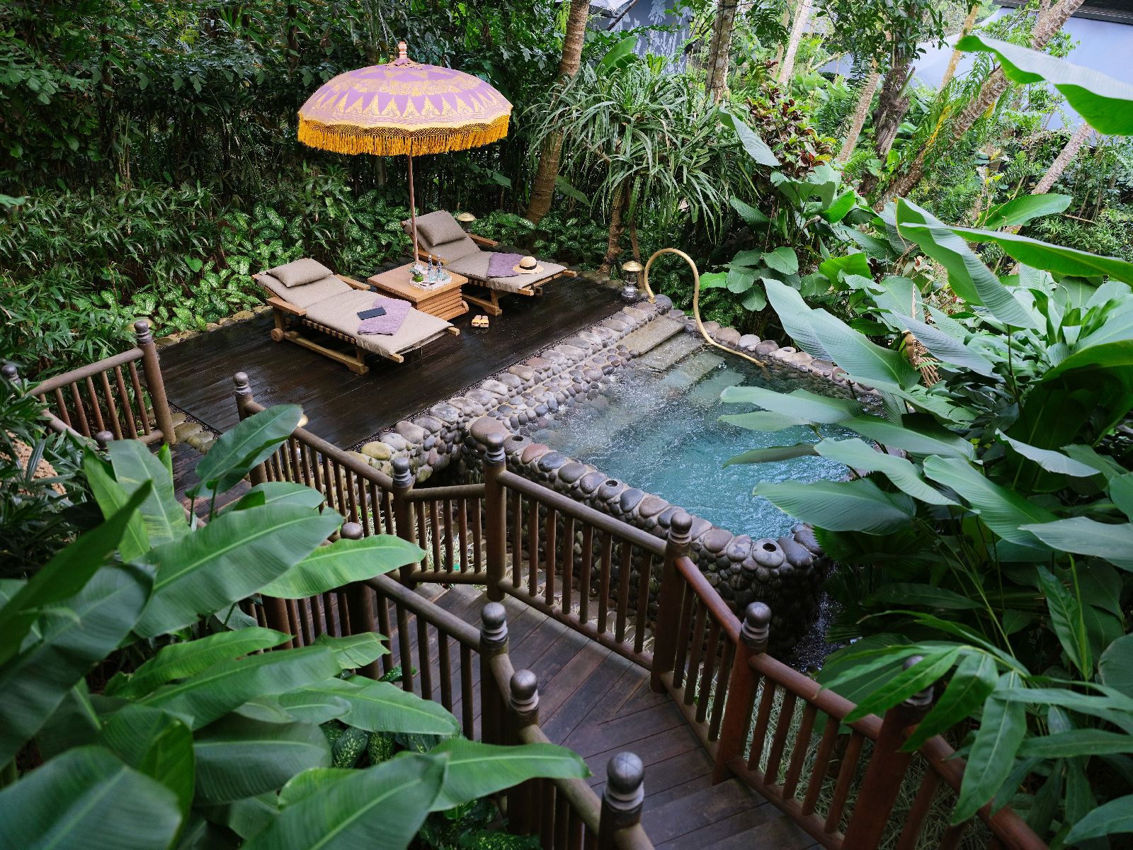Plunge pool in tropical gardens at the Capella Ubud in Bali