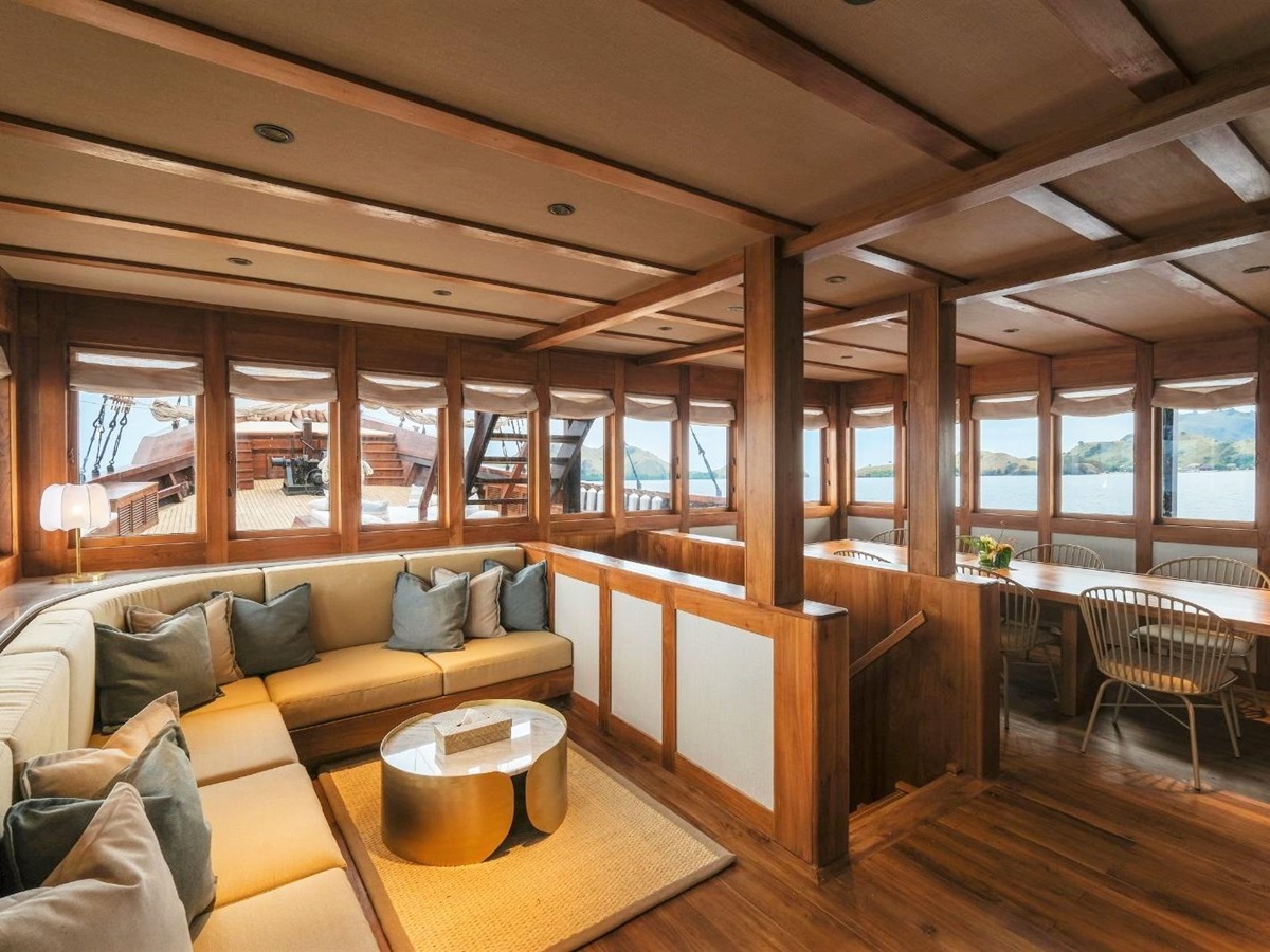 Interior lounge view of the Celestia phinisi in Indonesia