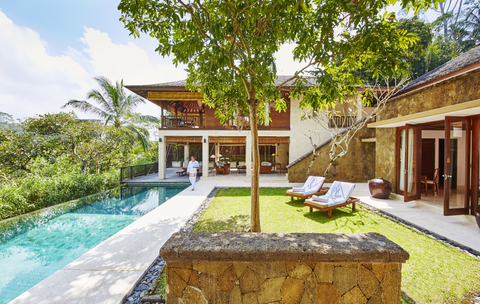 Pool and loungers overlooking the jungle at Giri Antara villa