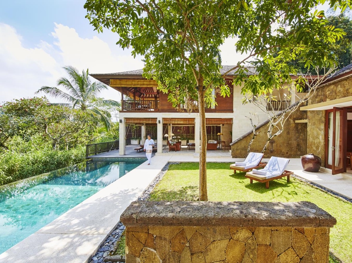 Pool and loungers overlooking the jungle at Giri Antara villa