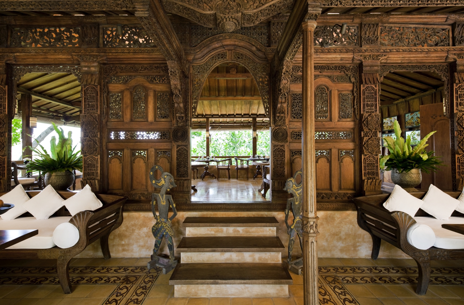 Entrance to the Kugus House restaurant, with intricate carvings in the wood, and comfortable seating