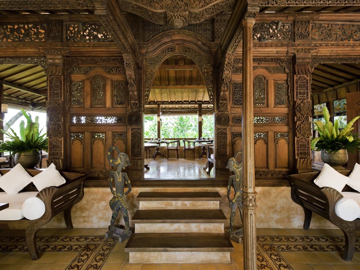 Entrance to the Kugus House restaurant, with intricate carvings in the wood, and comfortable seating