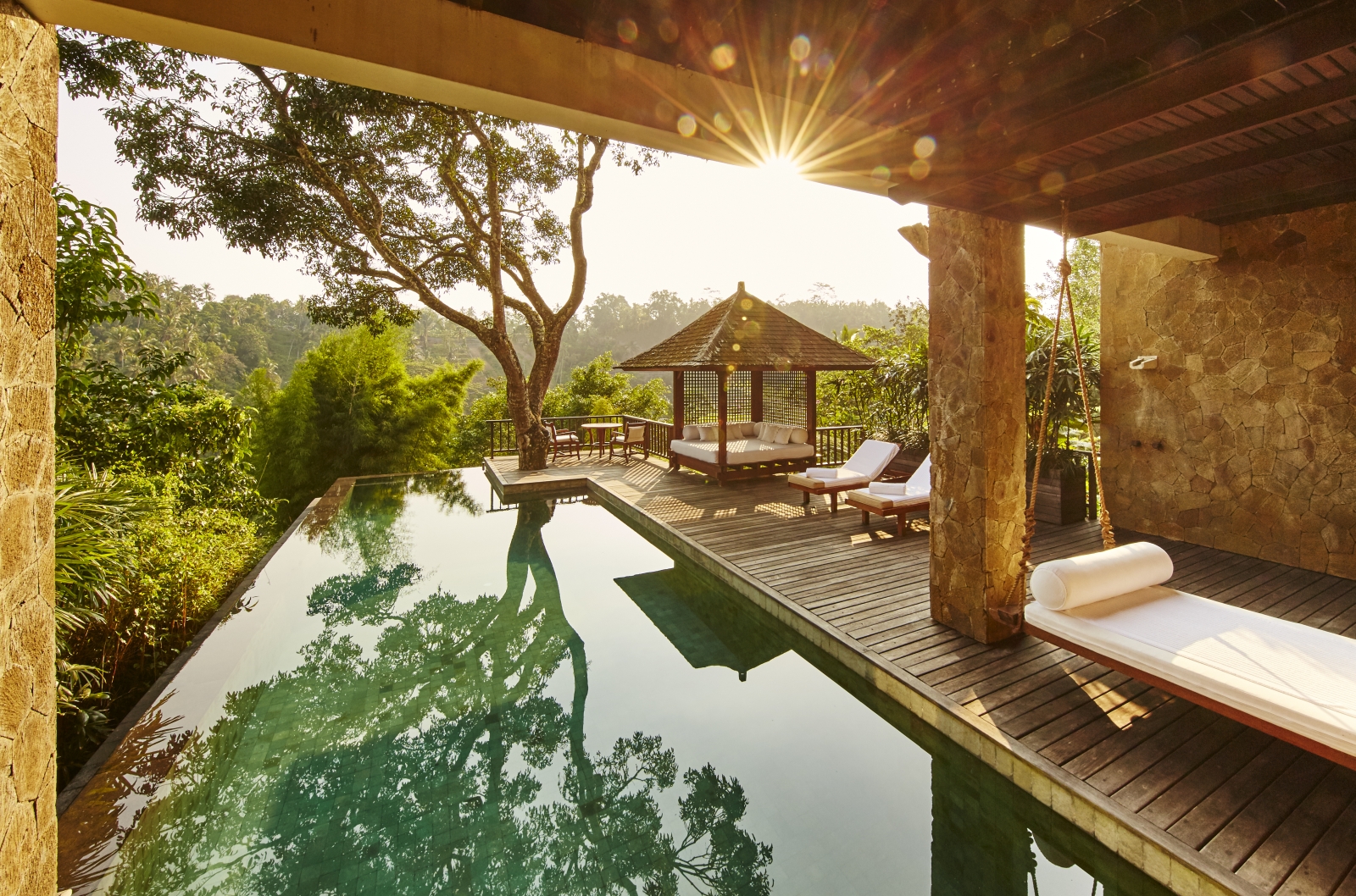 The pool and deck of Sukma Taru at dawn