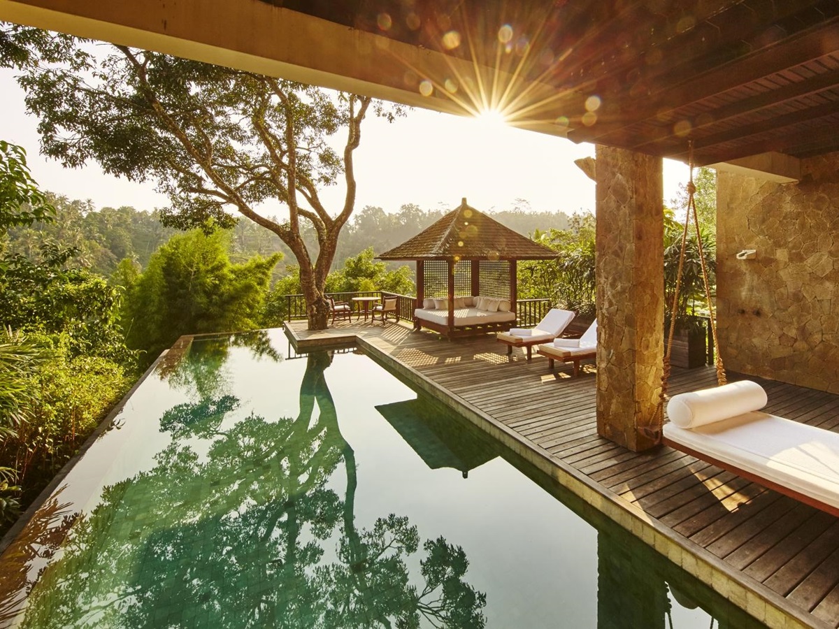 The pool and deck of Sukma Taru at dawn