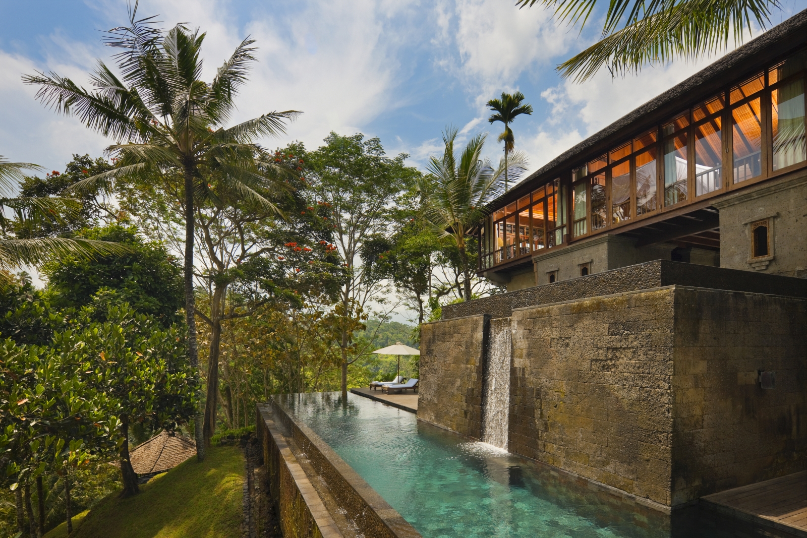 Exterior of Uma Bona residence, with waterfall and private pool