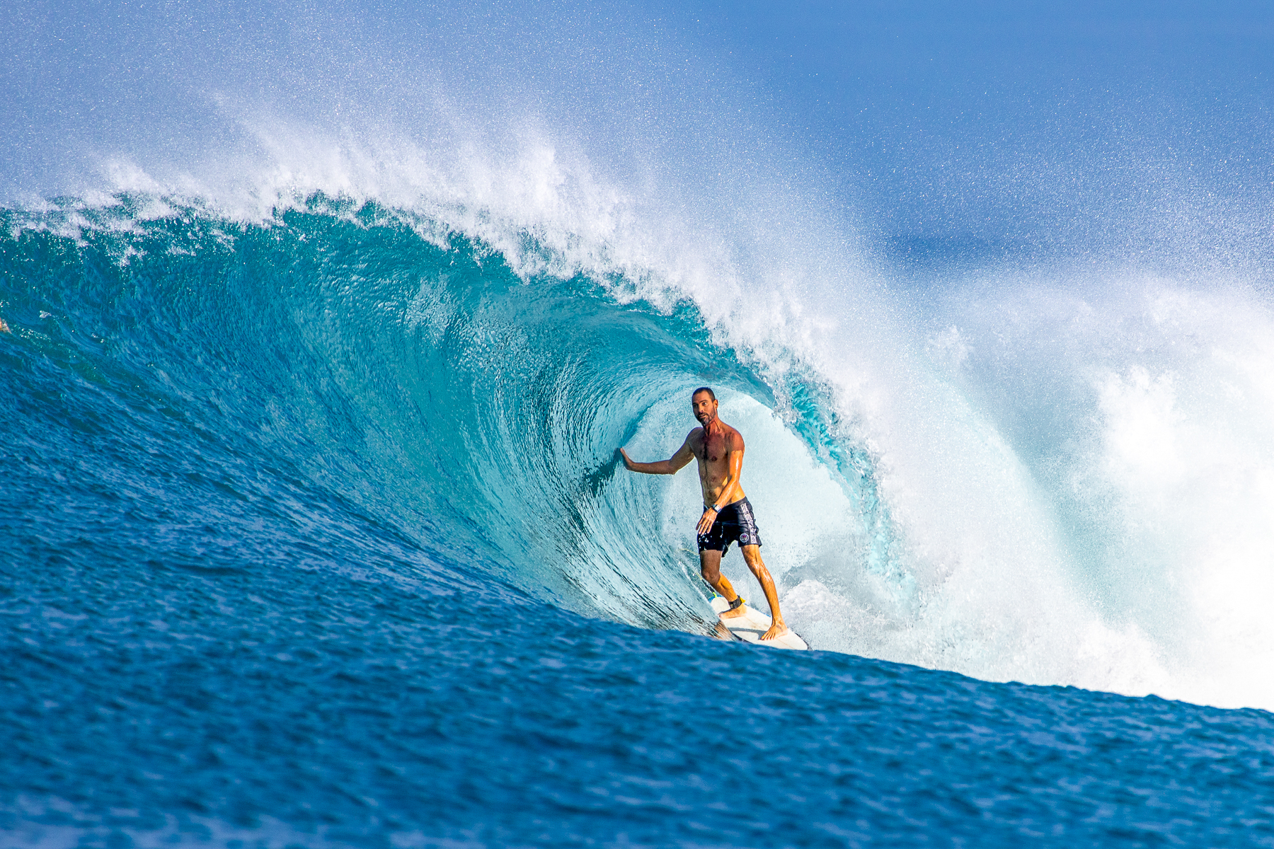 Surfing from the Fenides luxury phinisi in Indonesia