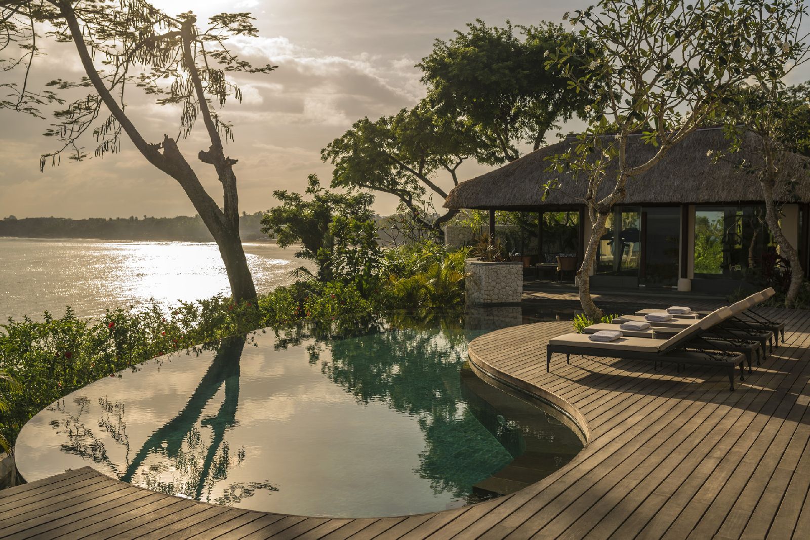 Private pool and terrace at sunset at the Four Seasons Bali at Jimbaran Bay