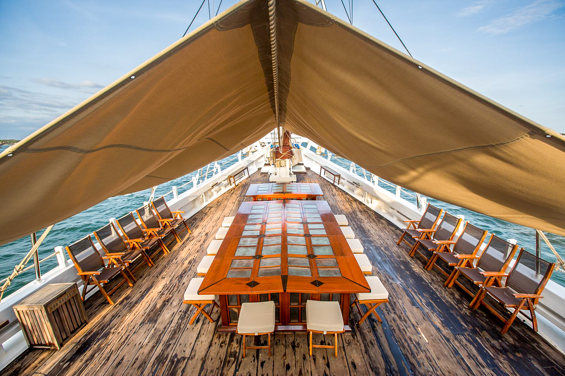 Alfresco dining setup on the deck of the Katharina luxury phinisi in Indonesia