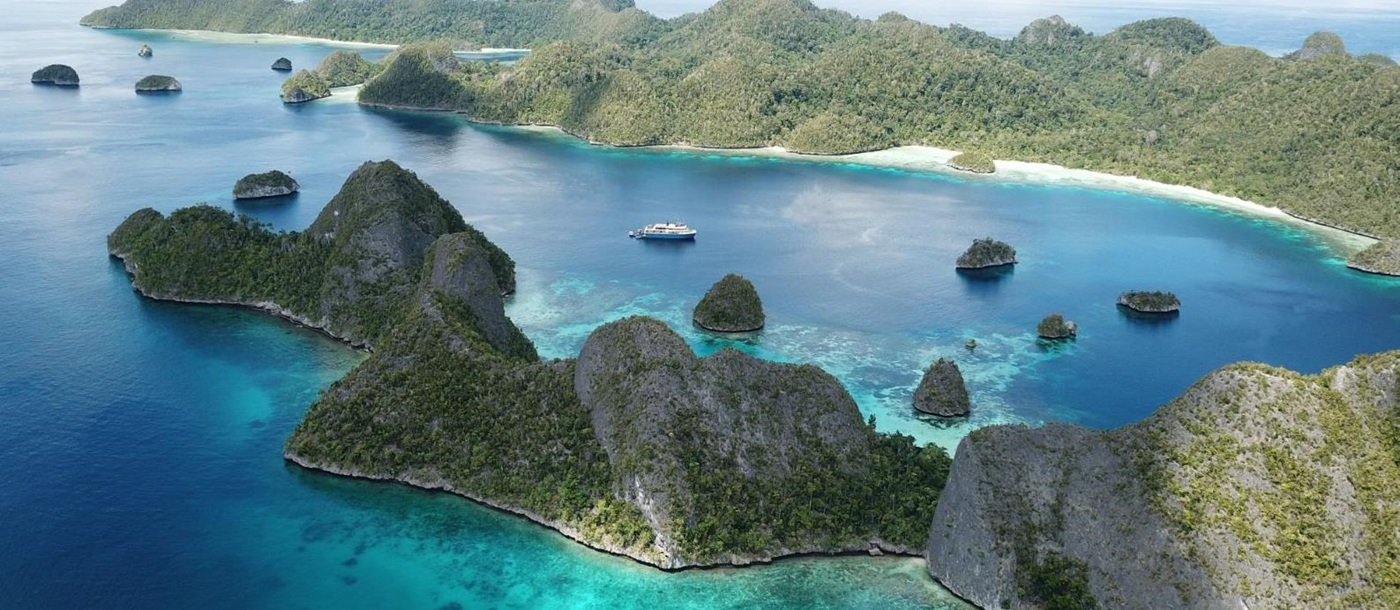 Aerial view of the Kudanil Explorer phinisi on Indonesia seas