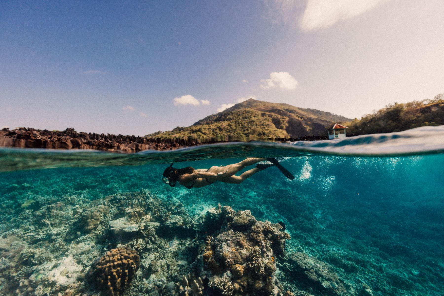 A woman snorkelling from the Kudanil Explorer in Indonesia