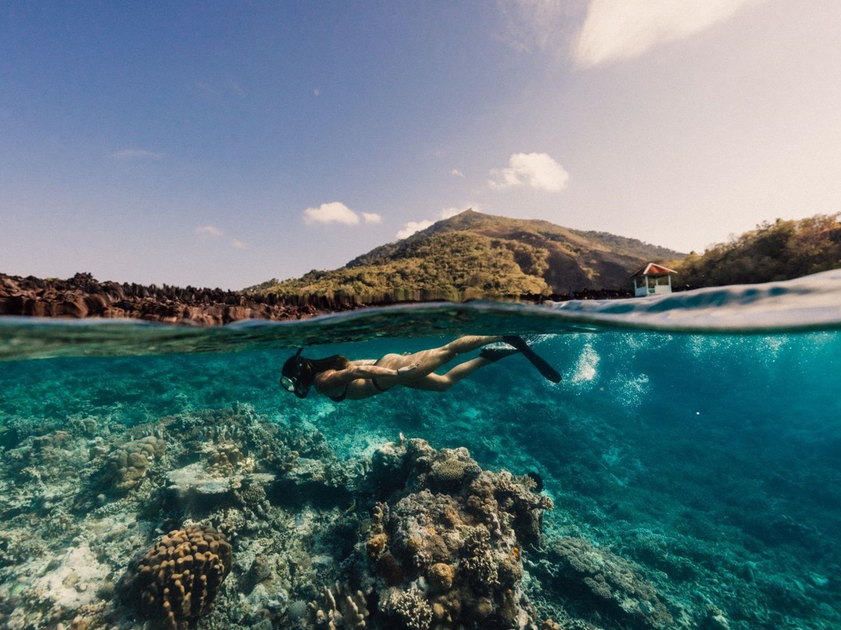 A woman snorkelling from the Kudanil Explorer in Indonesia