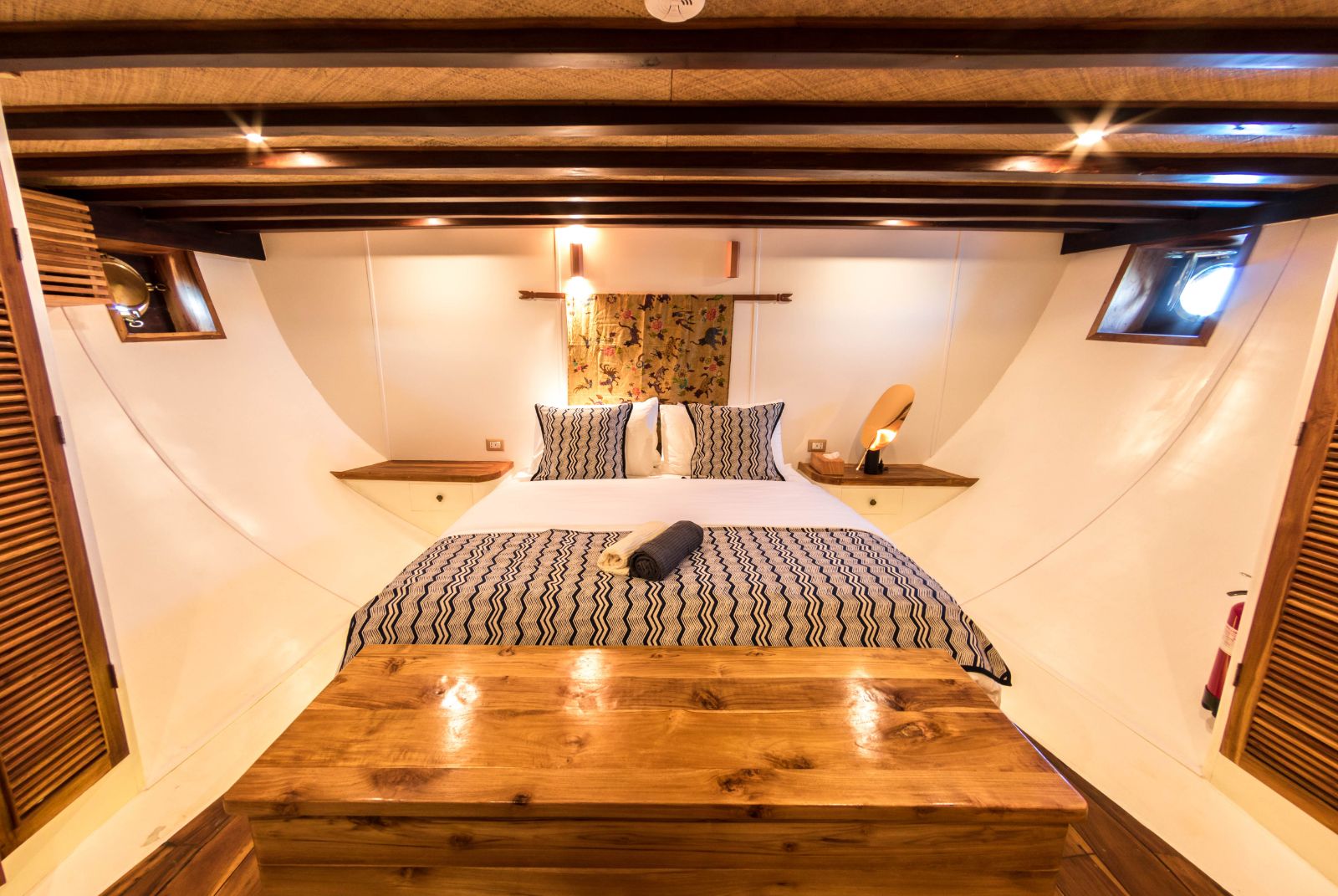 Double cabin with sloped walls onboard the Magia II phinisi on Indonesian waters