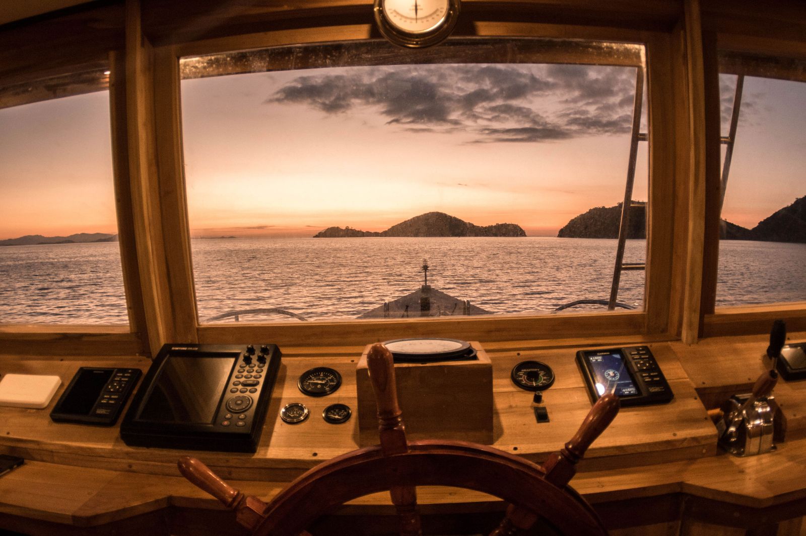 Helm onboard the the Magia II phinisi on Indonesian waters