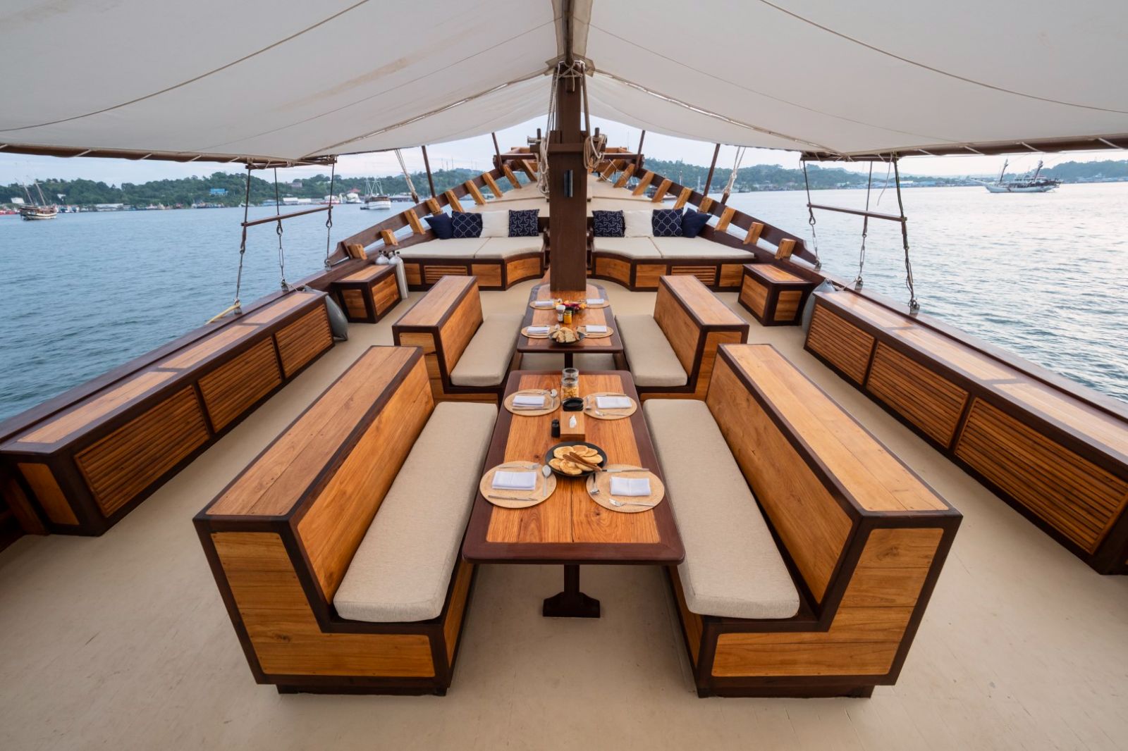 Outdoor lounge and seating area onboard the Majik phinisi in Indonesia