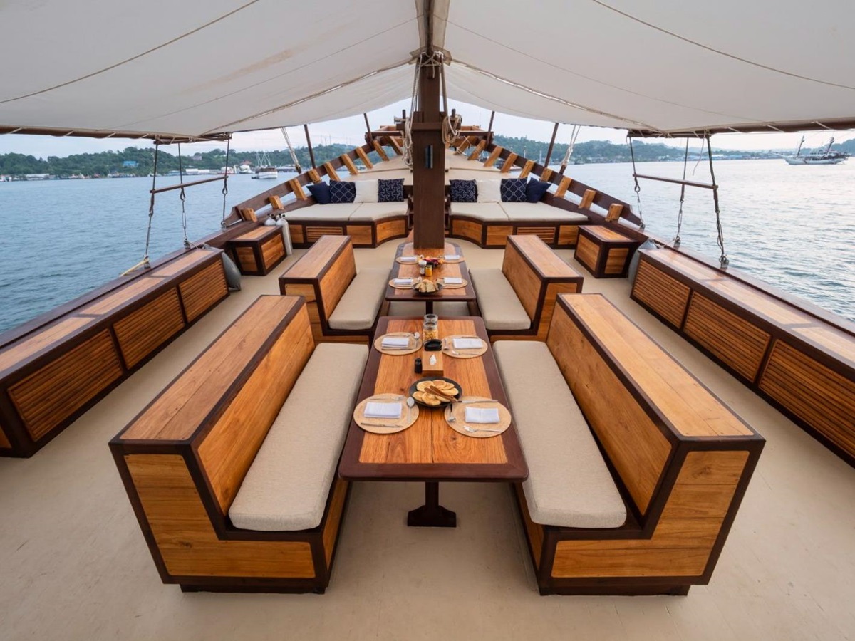 Outdoor lounge and seating area onboard the Majik phinisi in Indonesia