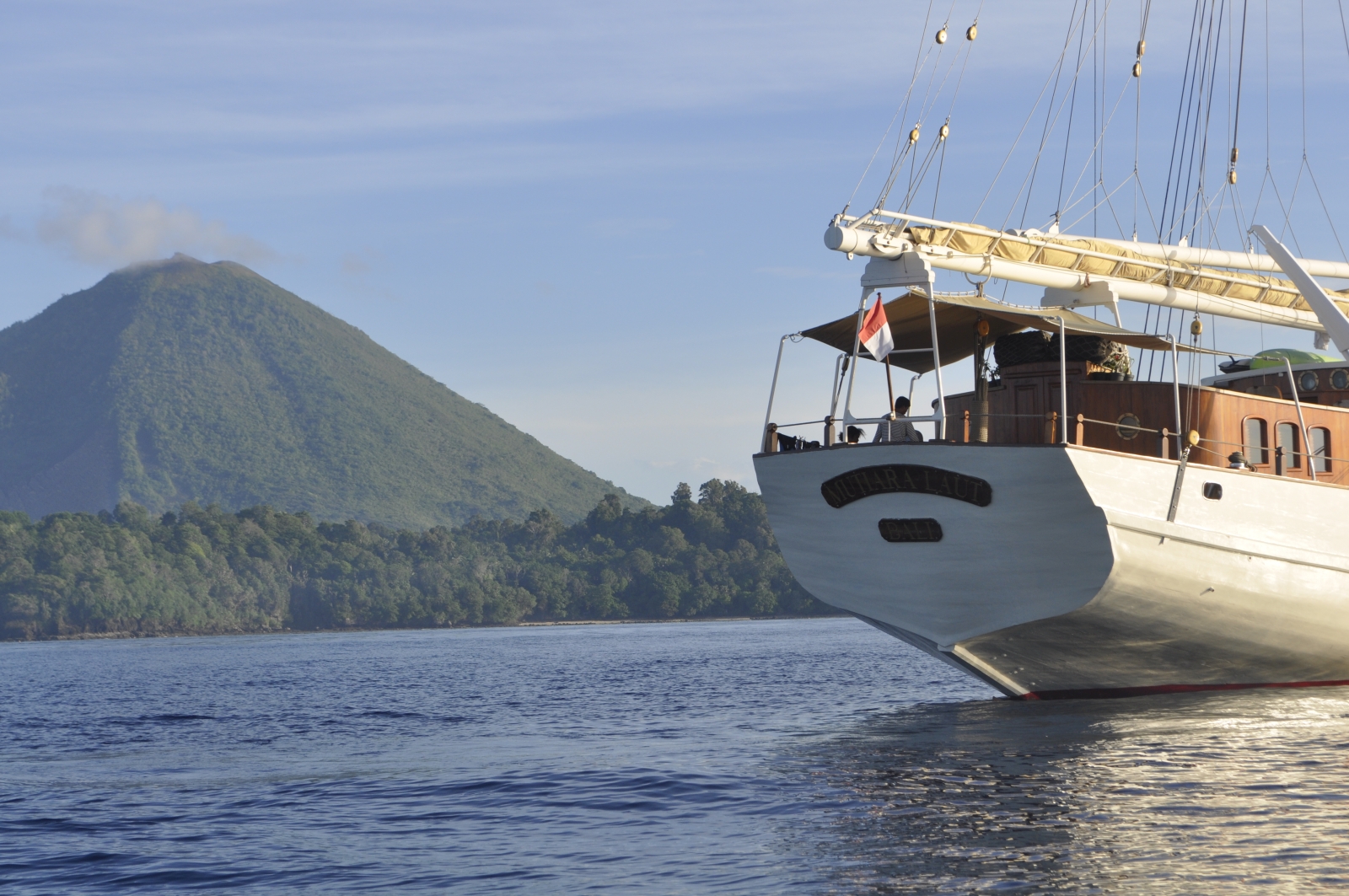Rear of the boat with large mountain in the background
