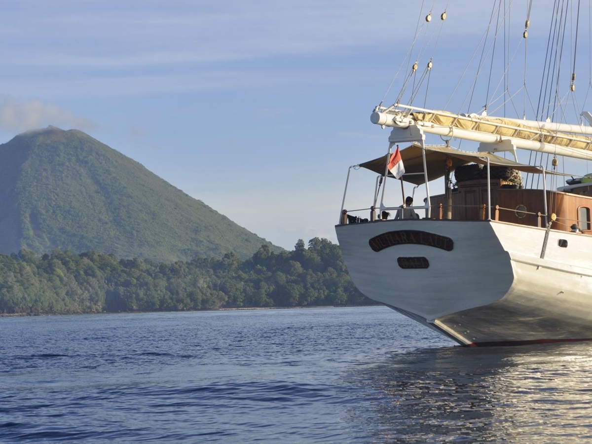 Rear of the boat with large mountain in the background