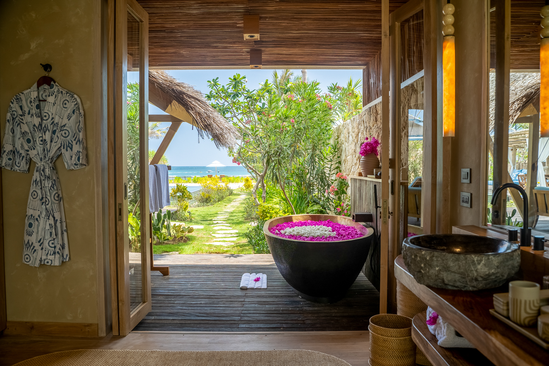 Guest bathroom with ocean views at NIHI Rote in Indonesia