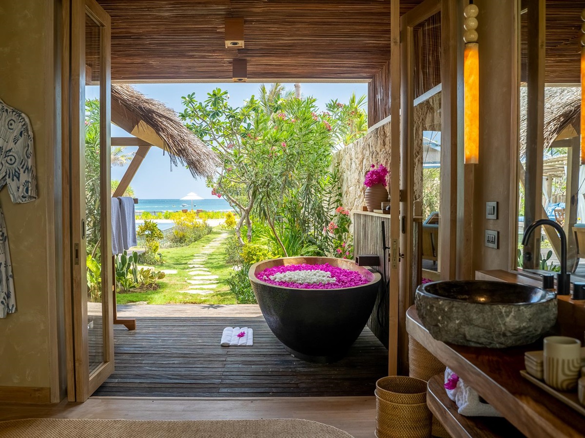 Guest bathroom with ocean views at NIHI Rote in Indonesia