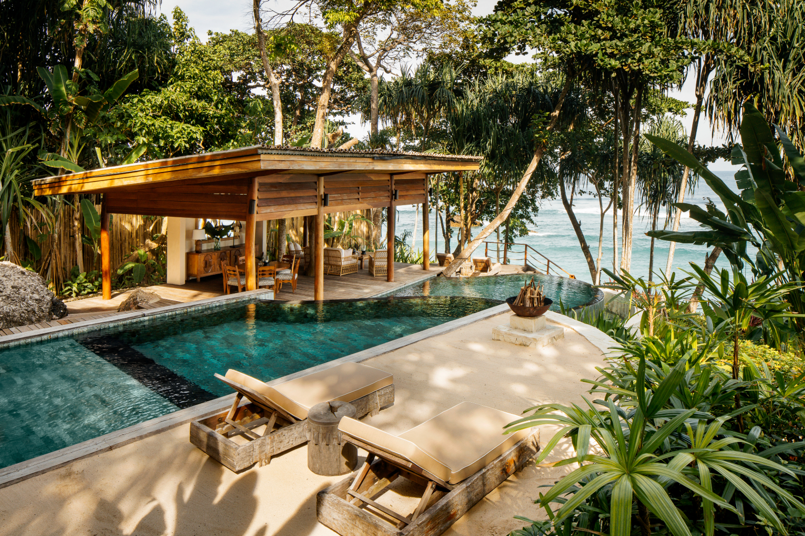 Private pool and loungers with sea view and jungle surroundings at Nihi Sumba Indonesia