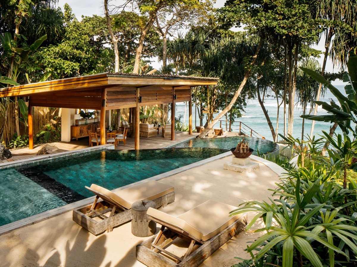 Private pool and loungers with sea view and jungle surroundings at Nihi Sumba Indonesia