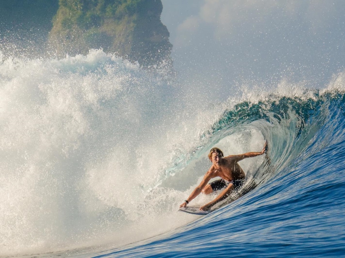 Surfer riding a wave at Nihi Sumba