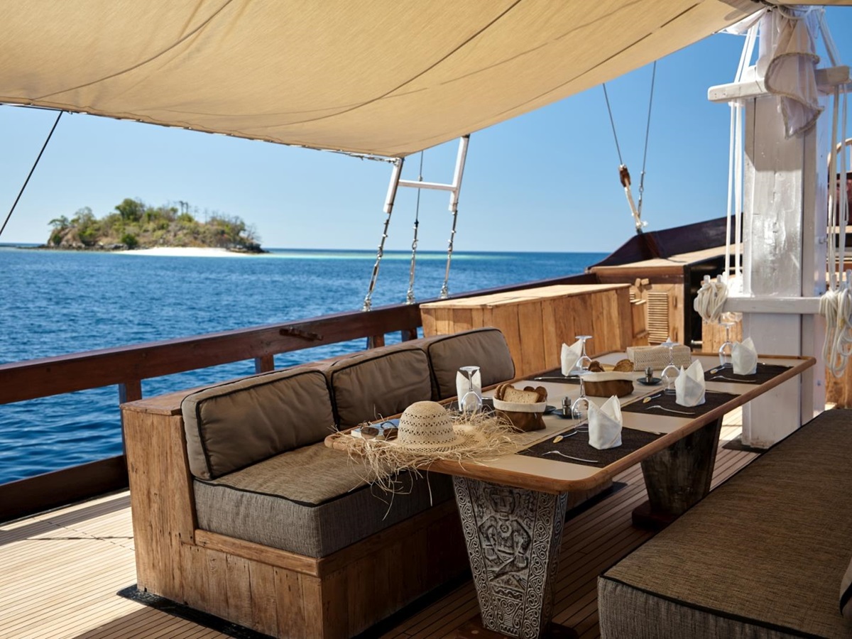Outdoor dining with dinner set-up in the shade
