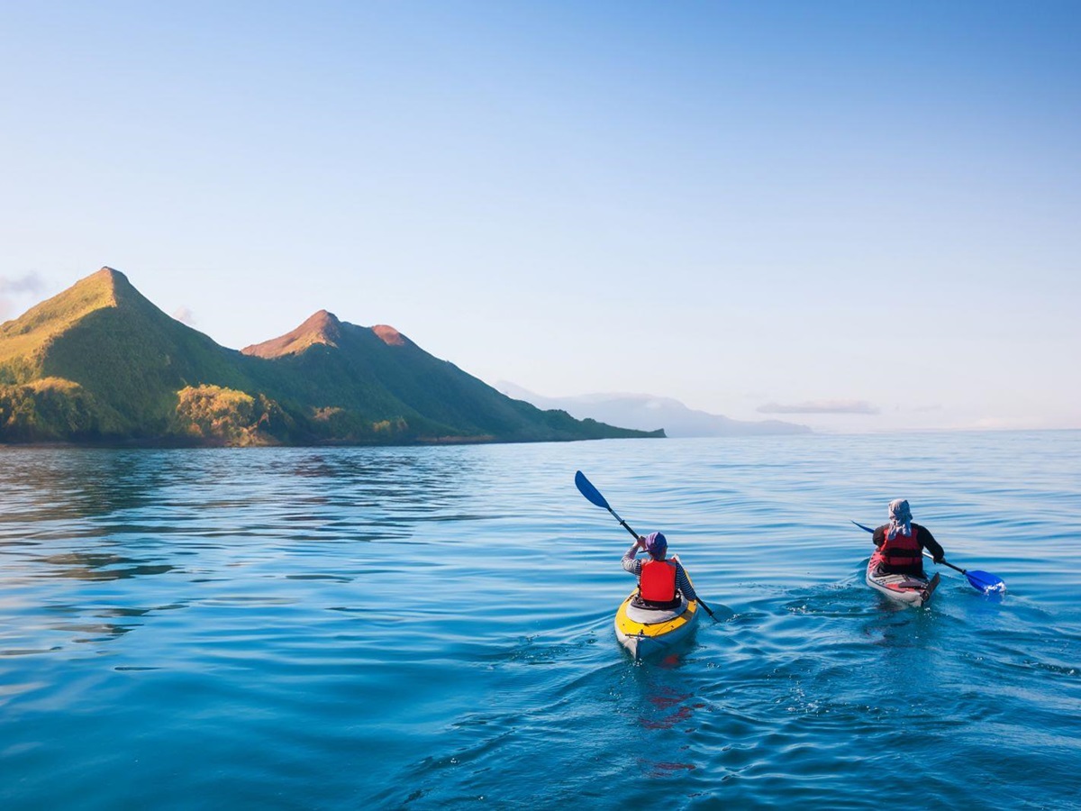 Two people kayaking in the ocean around the Komodo Islands