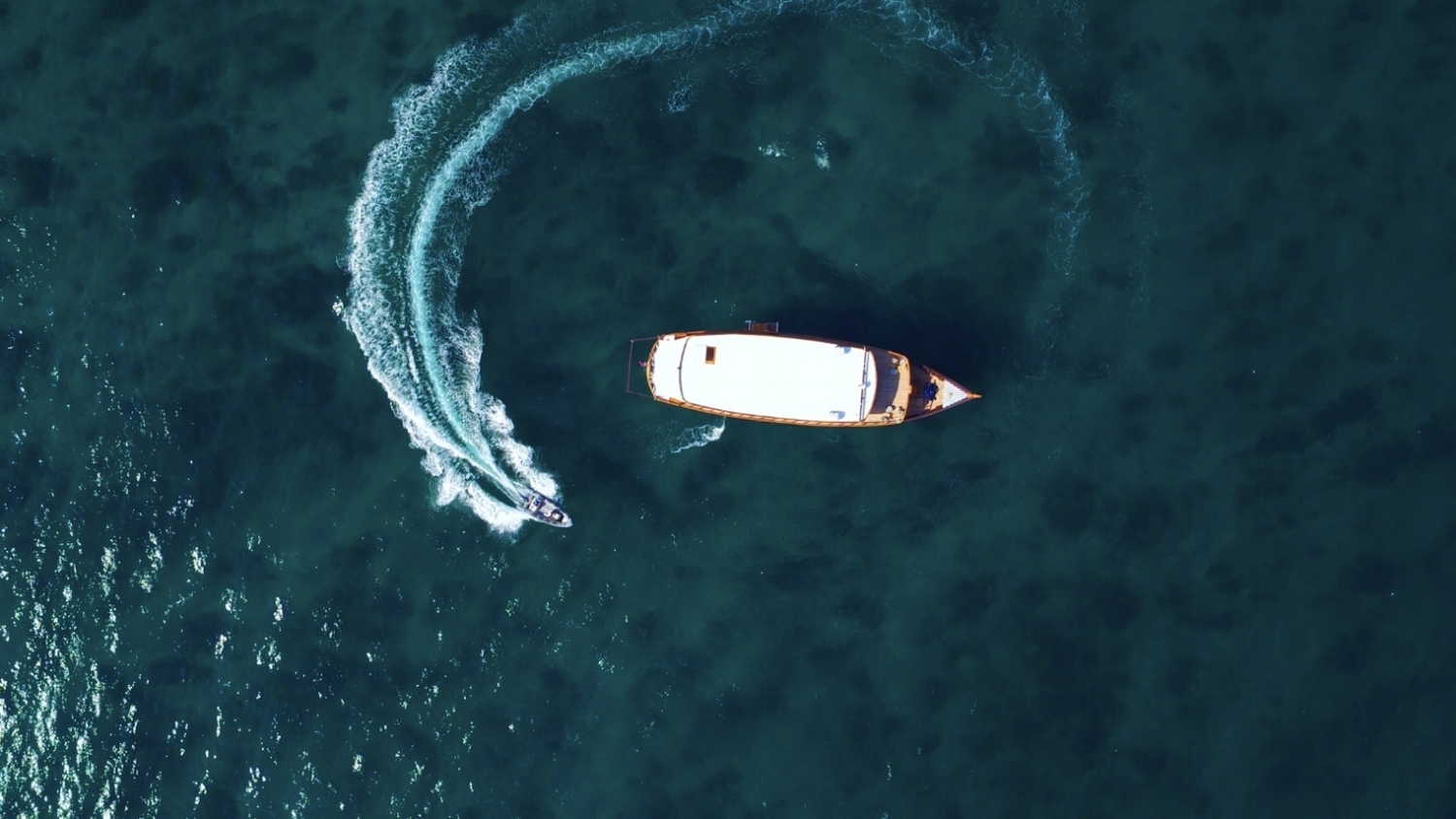 Aerial shot of Rascal with speedboat, in Indonesia