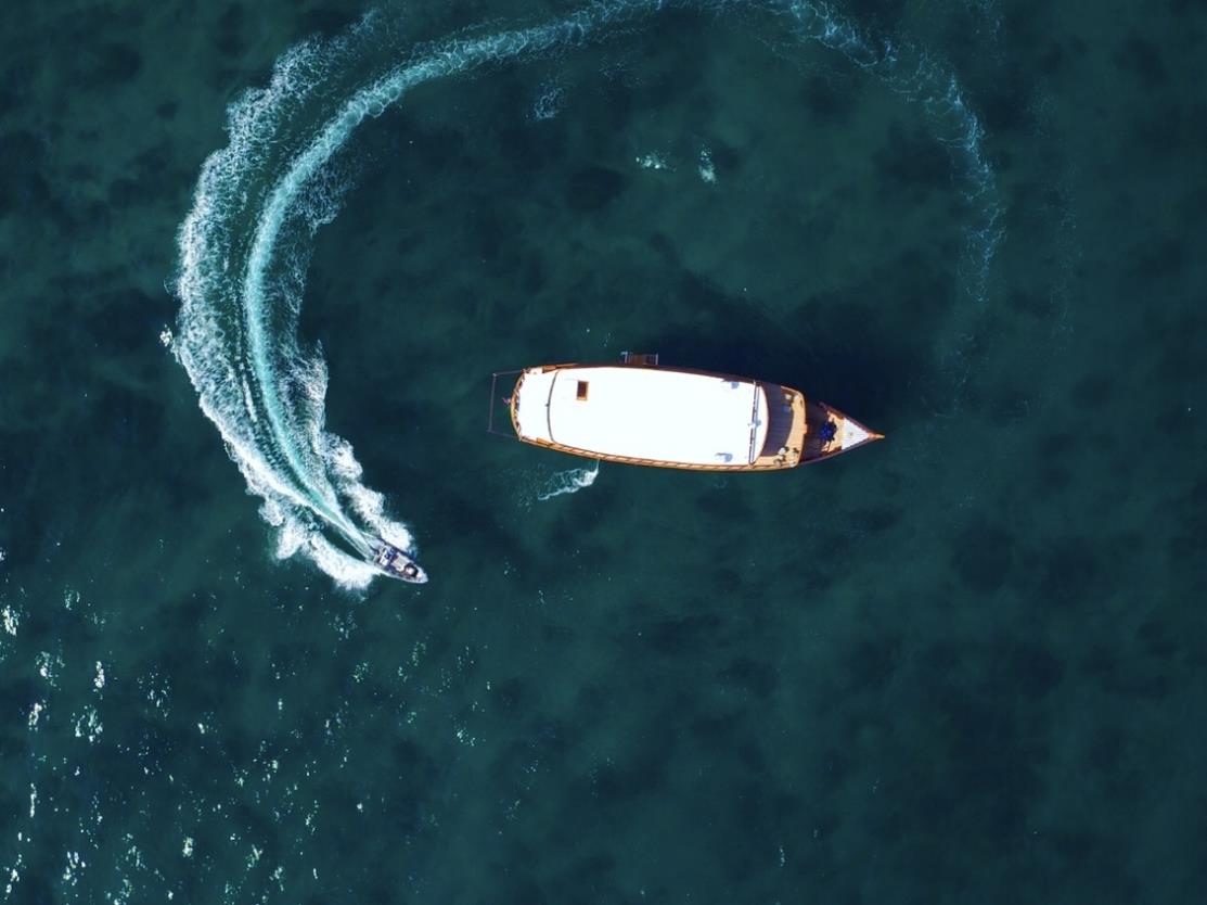 Aerial shot of Rascal with speedboat, in Indonesia