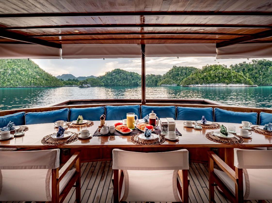Outdoor dining set up on Luxury Yacht Rascal