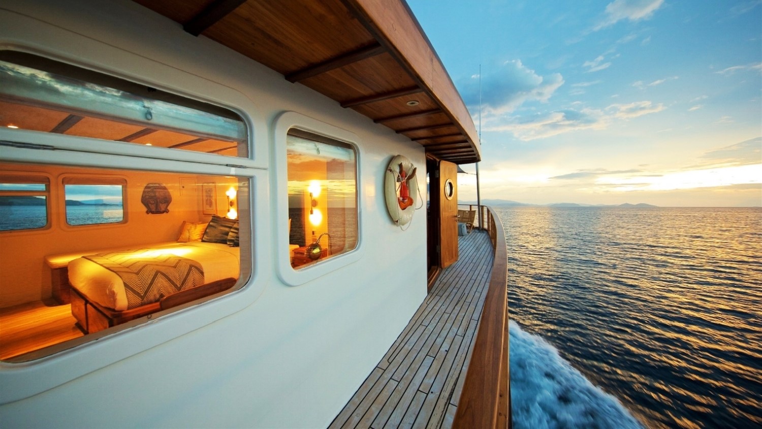 Side decking and view into Bedroom on Rascal at sunset in Indonesia