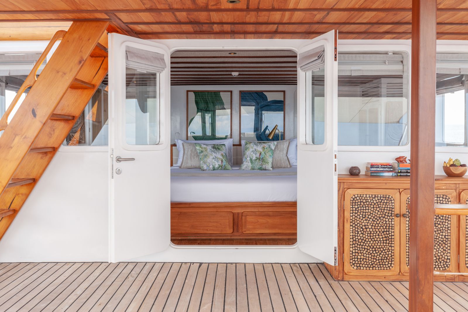 Master suite bedroom entrance to deck on the Rebel phinisi in Indonesia