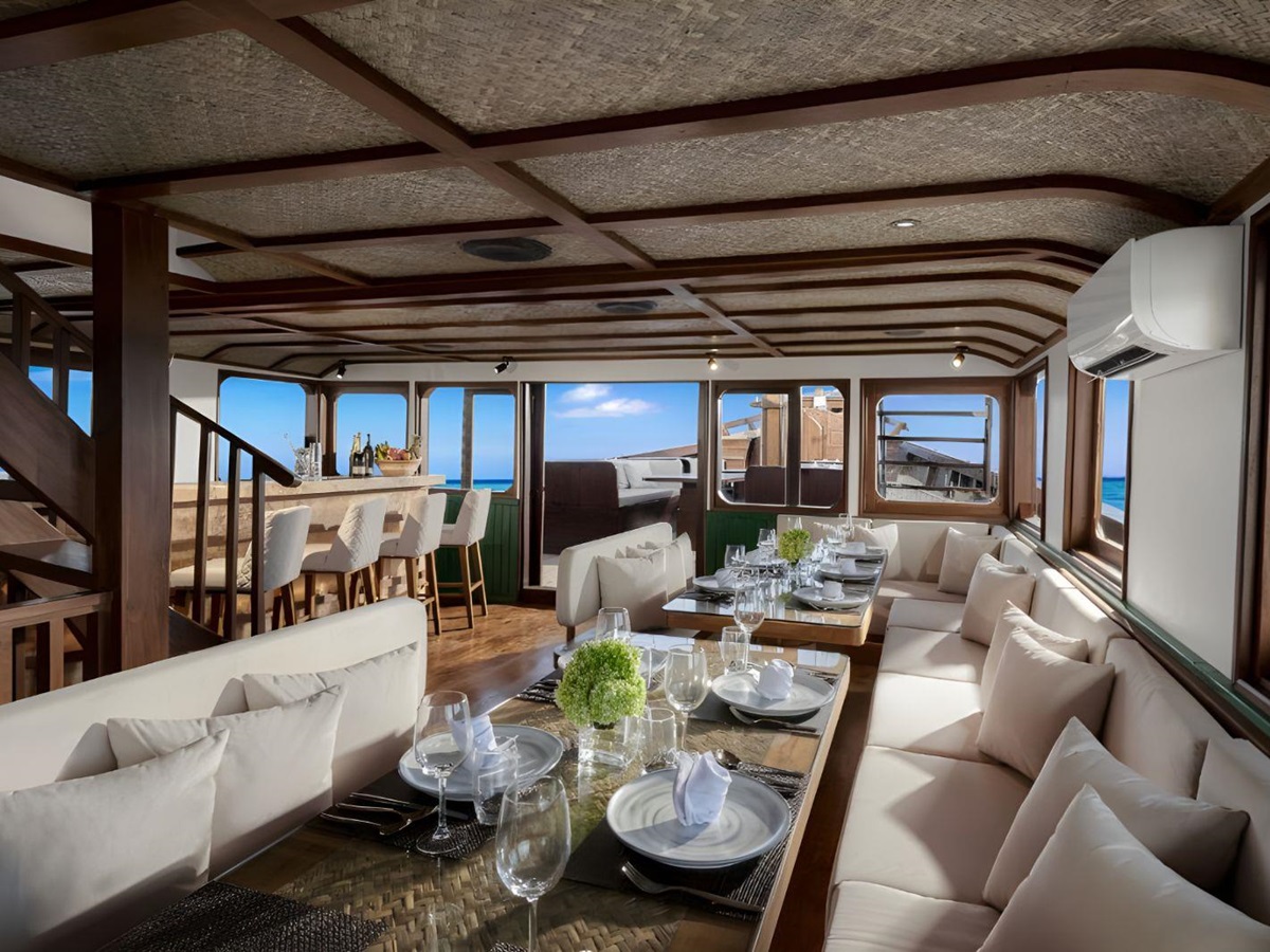 Indoor dining room onboard the Samsara Samudra phinisi in Indonesia