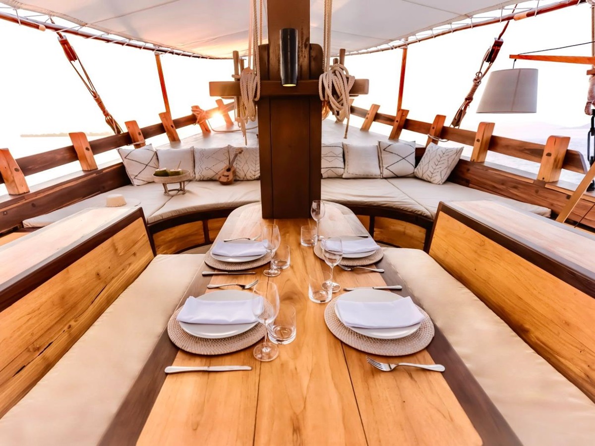 Laid dining table onboard the Senja phinisi in Indonesia