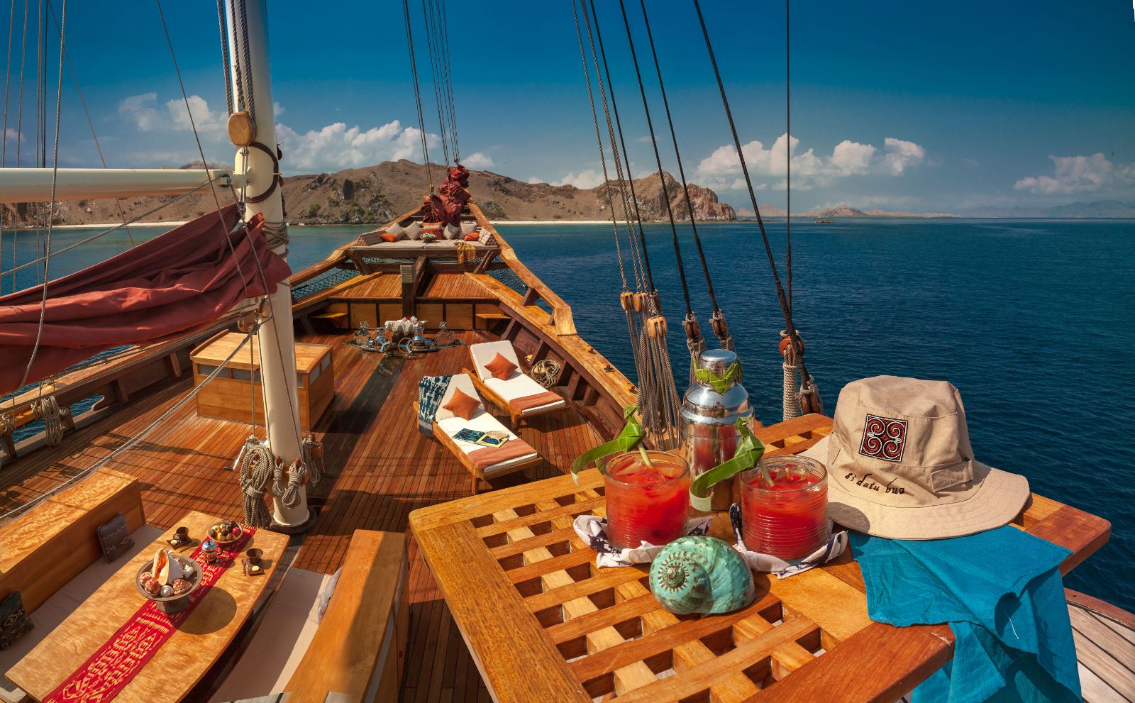 Cocktails and deck view on the Si Datu Bua phinisi in Indonesia