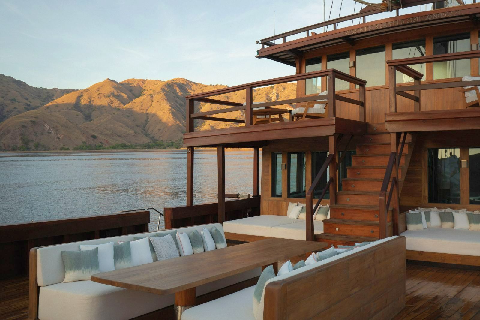 Dining tale and upper deck onboard the Vela Phinisi in Indonesia