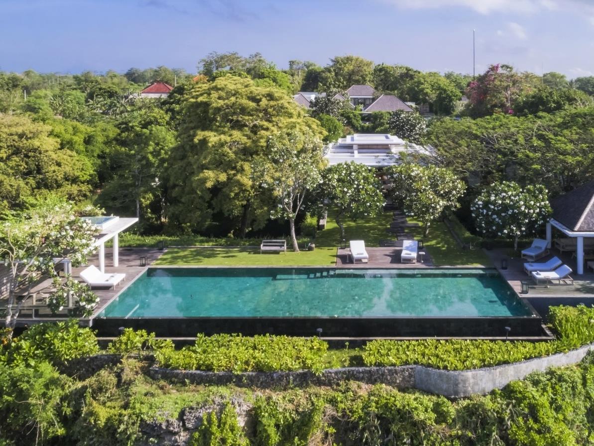 Drone view over the whole at Uluwatu Estate, Bali including the infinity pool