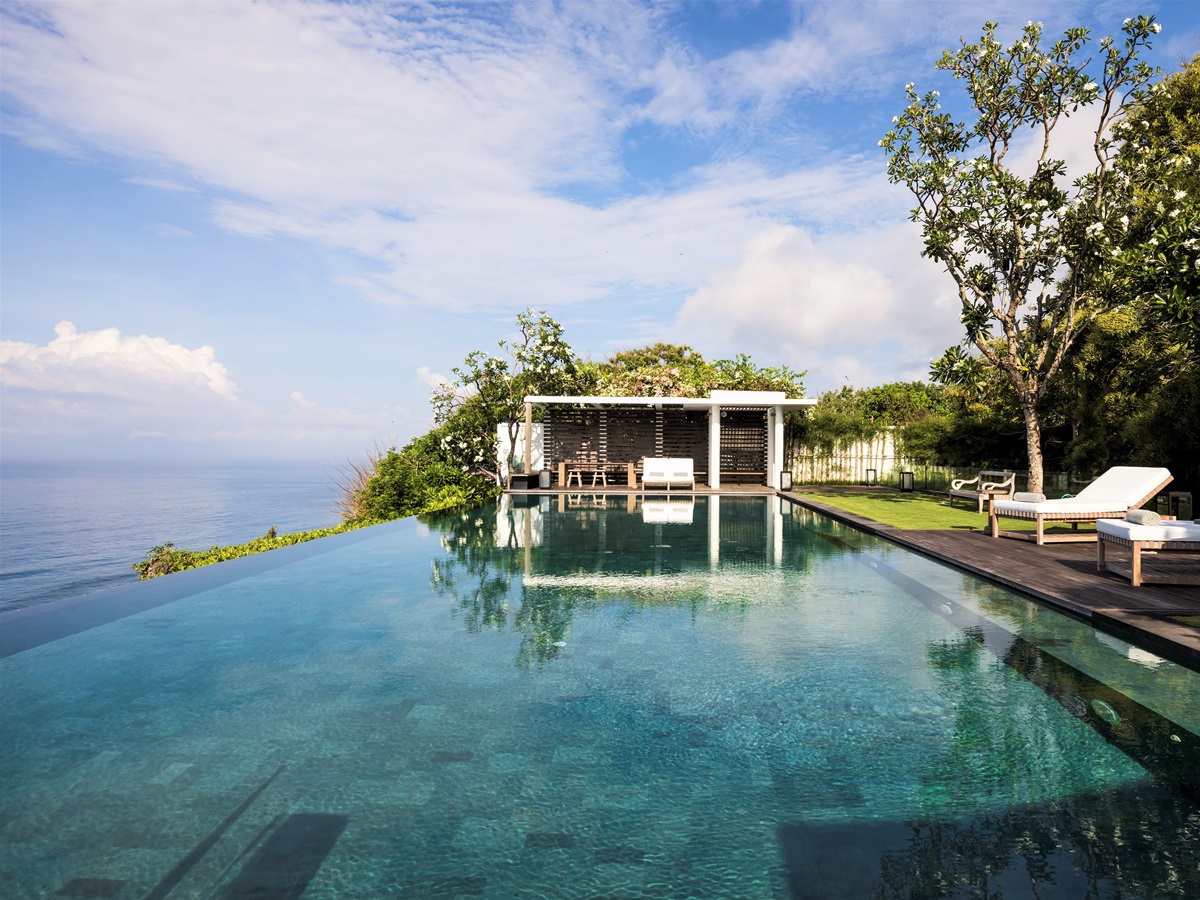 Seating area by the infinity pool at Uluwatu Estate, Bali