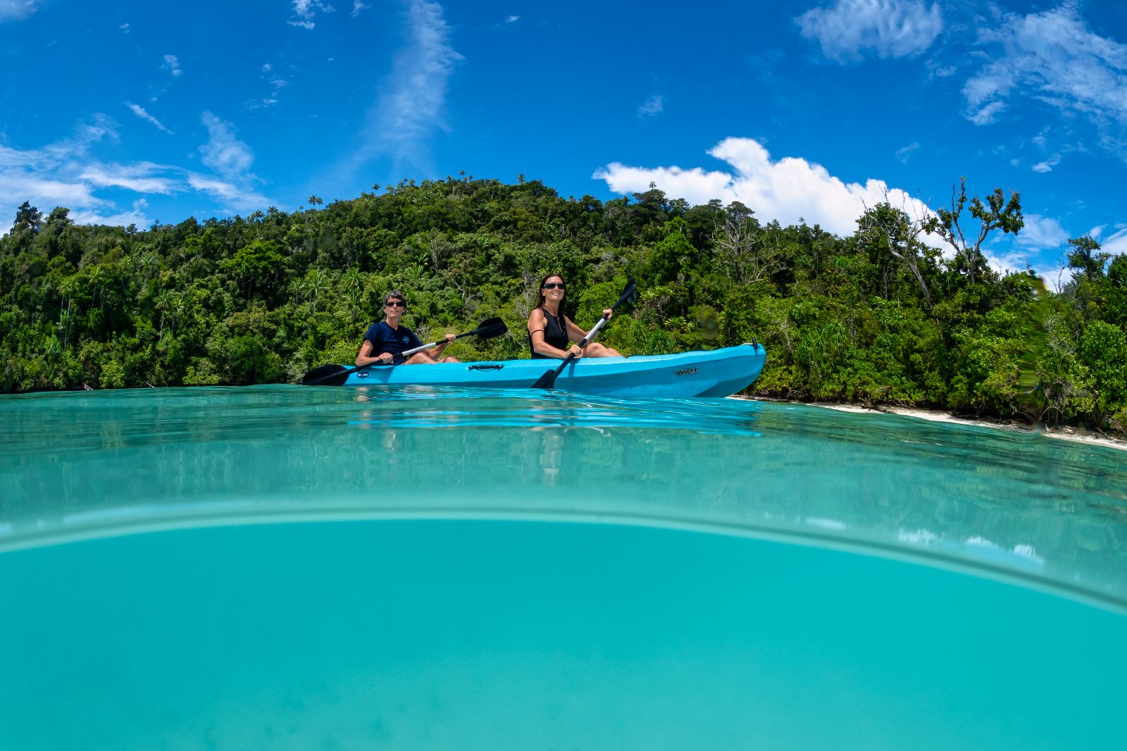Kayaking in the waters of Indonesia from the Majik phinisi